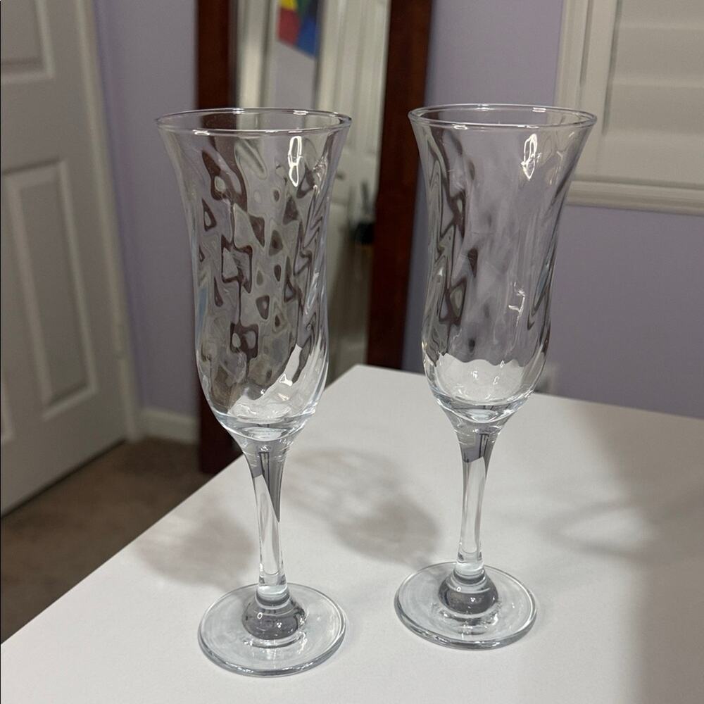 Set of Two clear Stemware with a Textured Cut Crystal Champagne Flutes